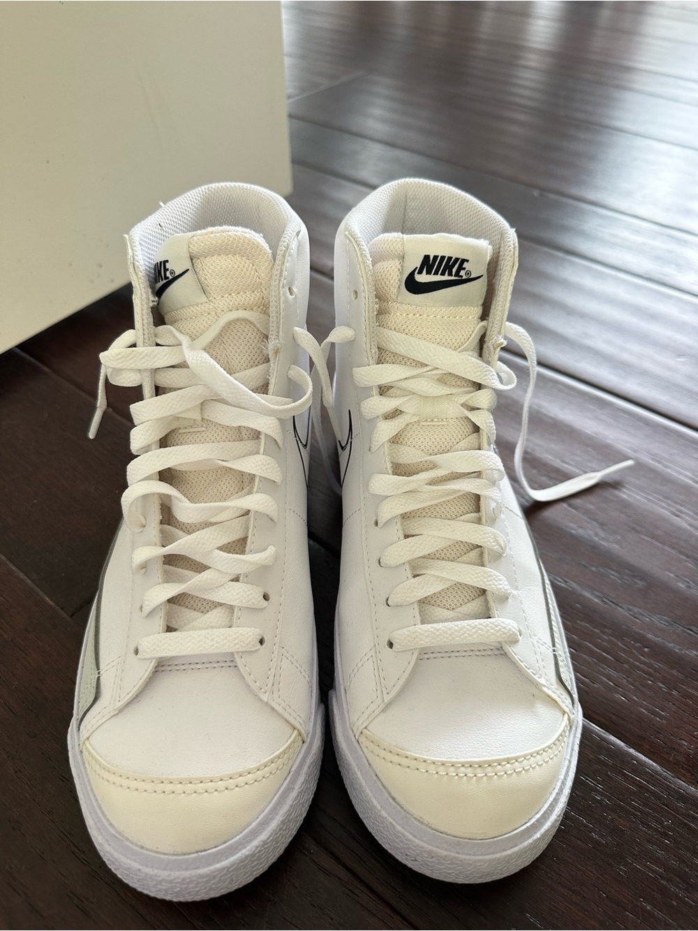 Nike White High-Top Sneakers with Black Logo